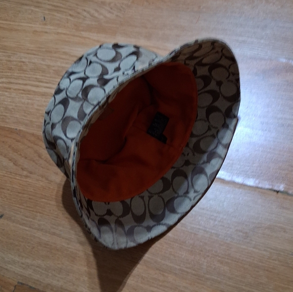 Coach Handbags - Coach Hat Patterned Bucket Hat with Orange Lining